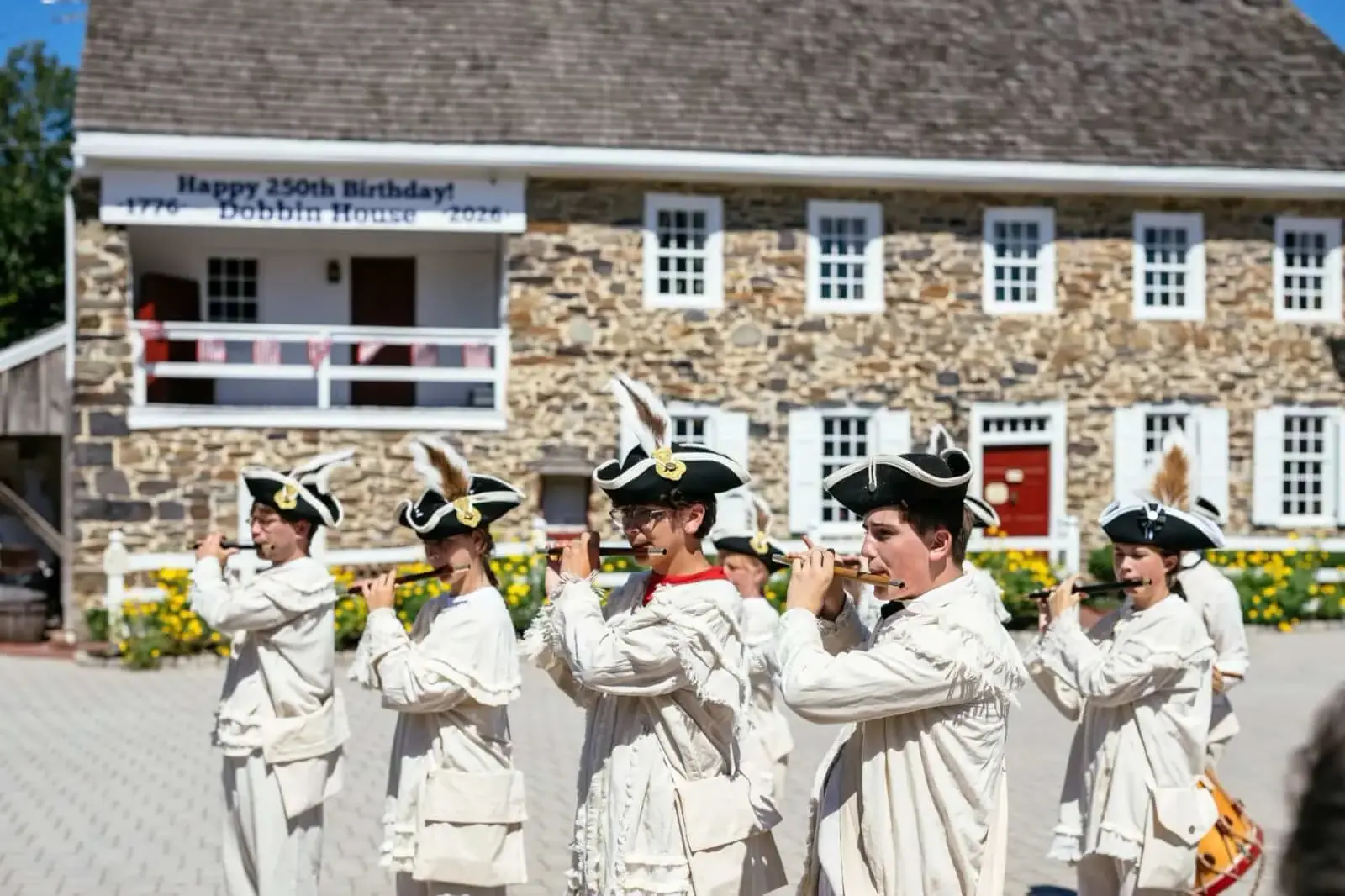 Period musicians perform outside Dobbin House at the anniversary celebration.