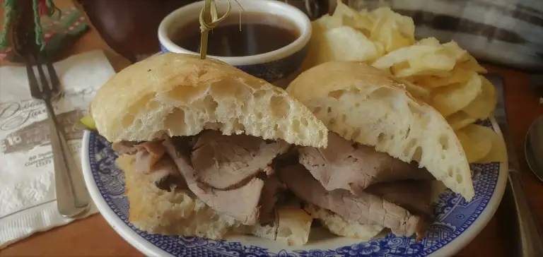 Dobbin House hot roast beef sandwich with chips and dipping jus.