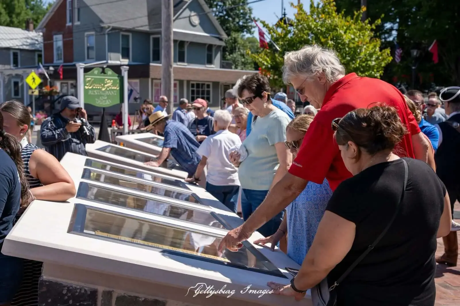 Visitors read the Charters of Freedom displays at Dobbin House Square.